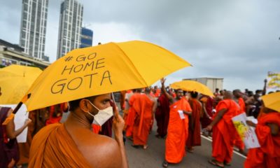 Buddhist monks protest outside the president's office in Colombo on Wednesday
