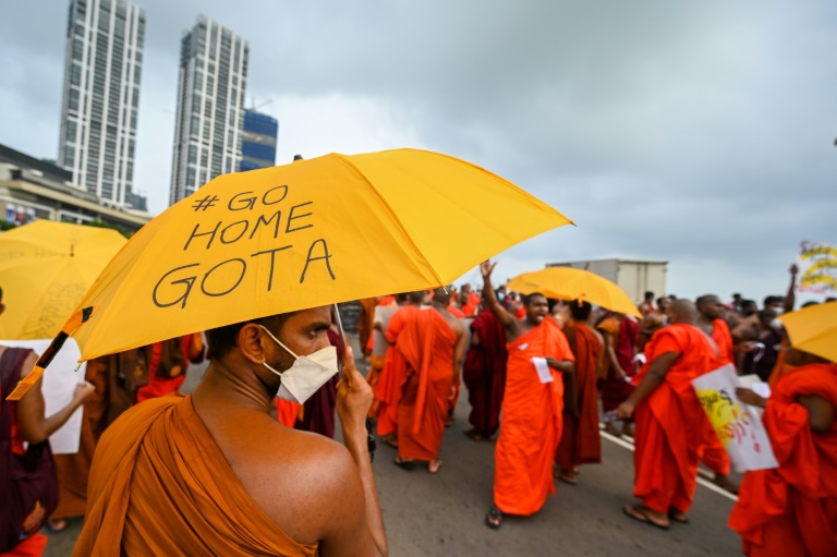 Buddhist monks protest outside the president's office in Colombo on Wednesday