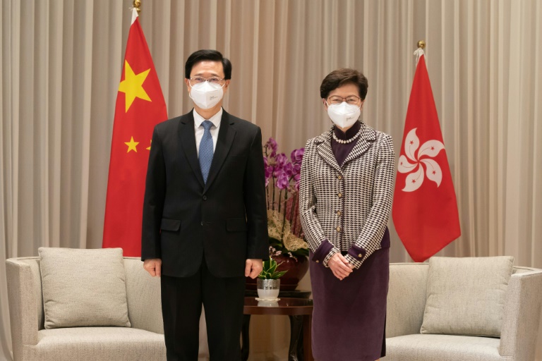 Hong Kong Chief Executive-elect John Lee (L) will take over from Carrie Lam on July 1