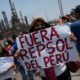 A resident of a community affected by the Repsol oil spill on the coast of Peru protests against the Spanish oil company, on January 20, 2022 in Callao