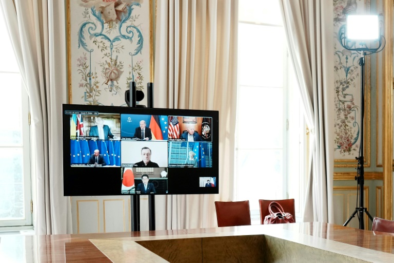 G7 leaders, pictured on screen during a video-conference at the Elysee Palace in Paris, committed to phasing out dependency on Russian oil in response to Moscow's invasion of Ukraine