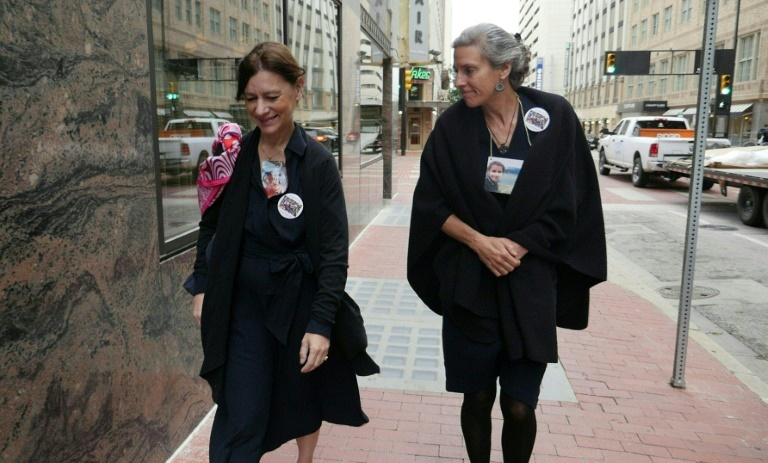 Catherine Berthet (L) whose daughter died in the Boeing 737 MAX crash in Ethiopia, arrives at court in Fort Worth, Texas, to challenge the aircraft maker's settlement deal with the US Department of Justice