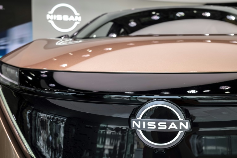 Nissan reported a positive full-year net profit for the first time in three years