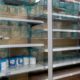 Grocery store shelves where baby formula is typically stocked are locked and nearly empty in Washington, DC, on May 11, 2022