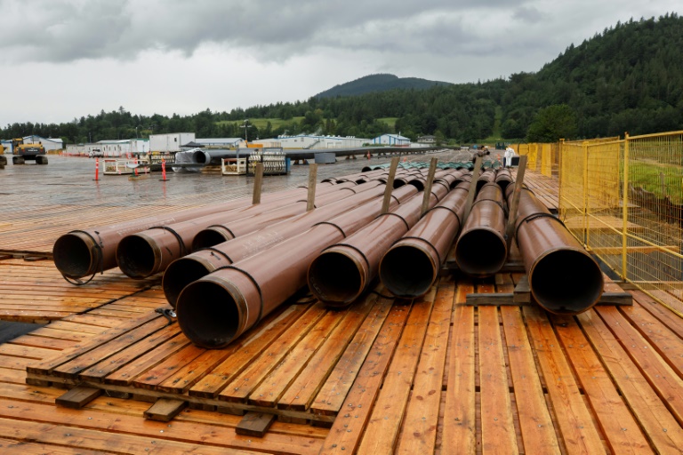 The Trans Mountain pipeline, whose pieces are seen here at a storage lot in Abbotsford, Canada in June 2021 waiting to be assembled, is no longer profitable, the office of the Parliamentary Budget Officer concluded in a report