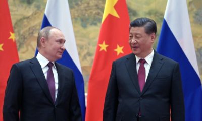 In a call last week, Chinese President Xi Jinping (R) assured his Russian counterpart Vladimir Putin (L)that China would support Russia on 'sovereignty and security'