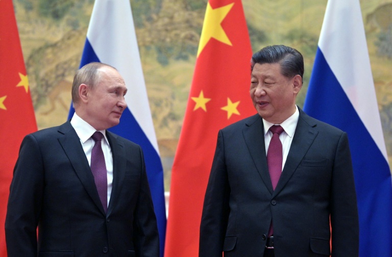 In a call last week, Chinese President Xi Jinping (R) assured his Russian counterpart Vladimir Putin (L)that China would support Russia on 'sovereignty and security'