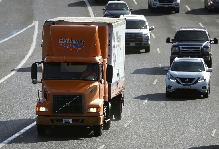 Drivers of long-haul delivery trucks, such as this one pictured January 2018, are contending with surging US gas prices