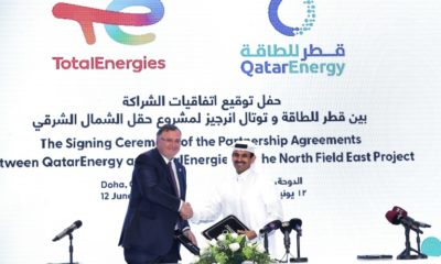 Qatar's Energy Minister and CEO of QatarEnergy Saad Sherida al-Kaabi (R) and French energy group TotalEnergies CEO Patrick Pouyanne attend a signing ceremony in Doha