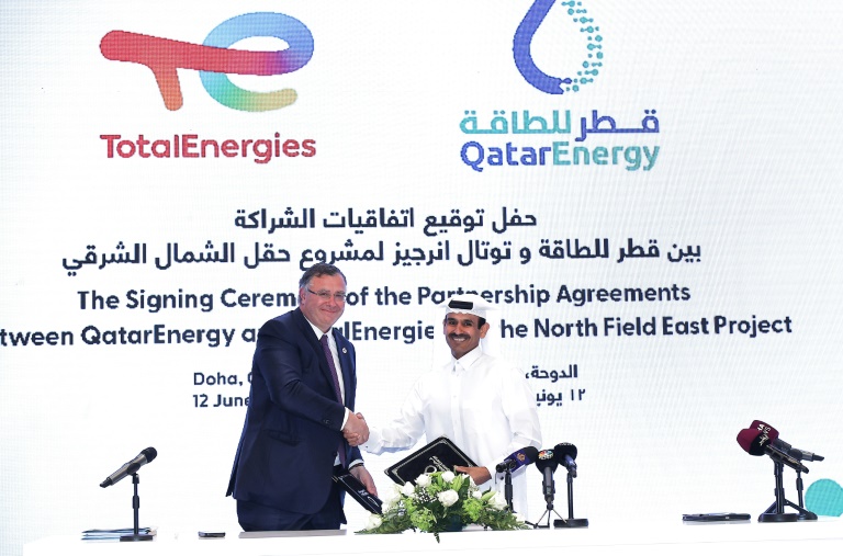 Qatar's Energy Minister and CEO of QatarEnergy Saad Sherida al-Kaabi (R) and French energy group TotalEnergies CEO Patrick Pouyanne attend a signing ceremony in Doha