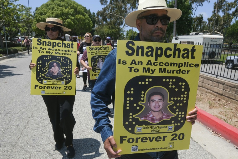 Protesters march in front of Snapchat headquarters in Santa Monica, California on June 13, 2022 demanding social media companies to block the sale of drugs on their platforms