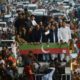 Former Pakistan prime minister Imran Khan and senior aides aboard a bus during a protest against rising prices in Rawalpindi in early July
