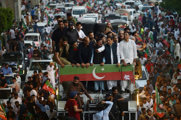 Former Pakistan prime minister Imran Khan and senior aides aboard a bus during a protest against rising prices in Rawalpindi in early July