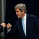 US Special Presidential Envoy for Climate John Kerry fists-bumps a guest at the Summit of the Americas in Los Angeles in June 2022