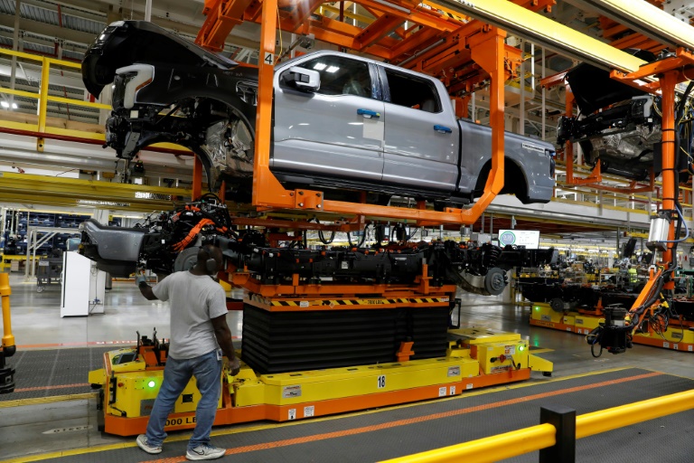 A cab is lowered on the frame of a battery-powered F-150 Lightning truck at Ford's Rouge Electric Vehicle Center in Dearborn, Michigan