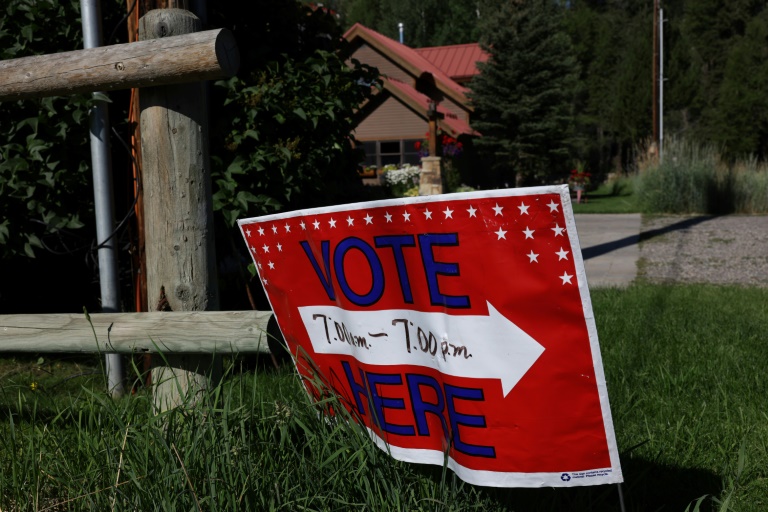 A sign directs voters to a polling place at the Old Wilson Schoolhouse August 16, 2022 in Wilson, Wyoming ahead of primary elections leading up to the Novermber 8 midterm elections