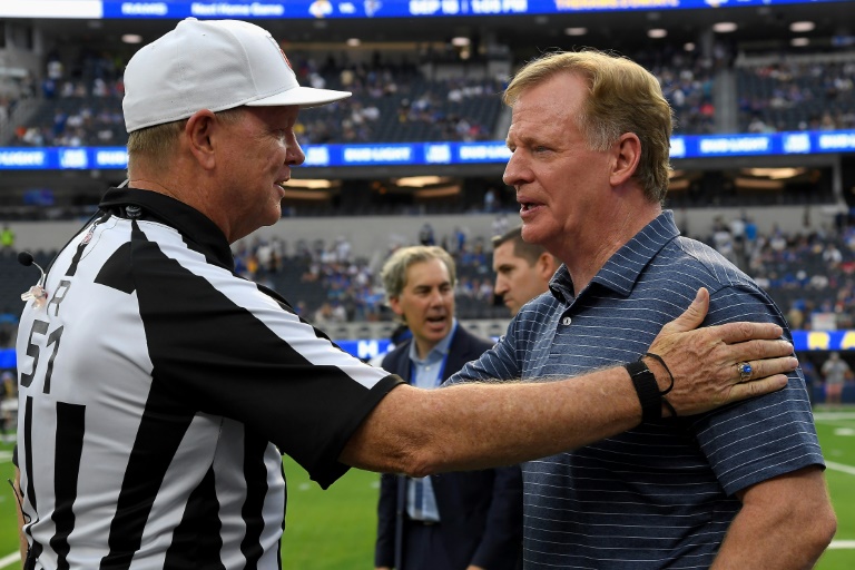 NFL commissioner Roger Goodell (R), seen speaking with a referee before a Los Angeles-Buffalo game September 8, 2022 in California, has welcomed a deal giving YouTube streaming rights to most Sunday games starting in 2023