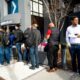 Silicon Valley Bank customers wait in line at SVB’s headquarters in Santa Clara, California on March 13, 2023