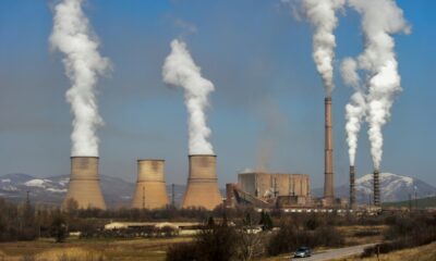 The EU is broadening an emissions trading scheme to more industries and lowering quotas of allowable polluting gases