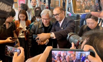 Nvidia chief Jensen Huang (centre L) poses for photographs before attending a press conference at Computex 2023 in Taipei on May 30, 2023.