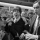 Fans surround the Beatles' members Paul McCartney (C) and George Harrison (2nd R) at their arrival at Orly airport on June 20, 1965, before their concert at the Palais des Sports the same evening