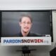 Edward Snowden speaking via video link at a news conference for the launch of a campaign calling for then president Obama to pardon him in September 2016 in New York City