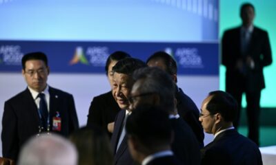 Chinese President Xi Jinping (C) said officials must ensure 'comprehensive, open and transparent' legal treatment of foreign entities