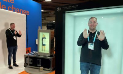 A visitor at CES Las Vegas experiments with the Holobox hologram box, January 11, 2024