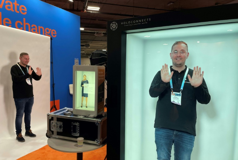 A visitor at CES Las Vegas experiments with the Holobox hologram box, January 11, 2024