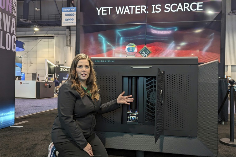 Genesis Systems co-founder Shannon Stuckenberg discusses the inner workings of a WaterCube device that extracts water from the air during the Consumer Electronics Show in Las Vegas